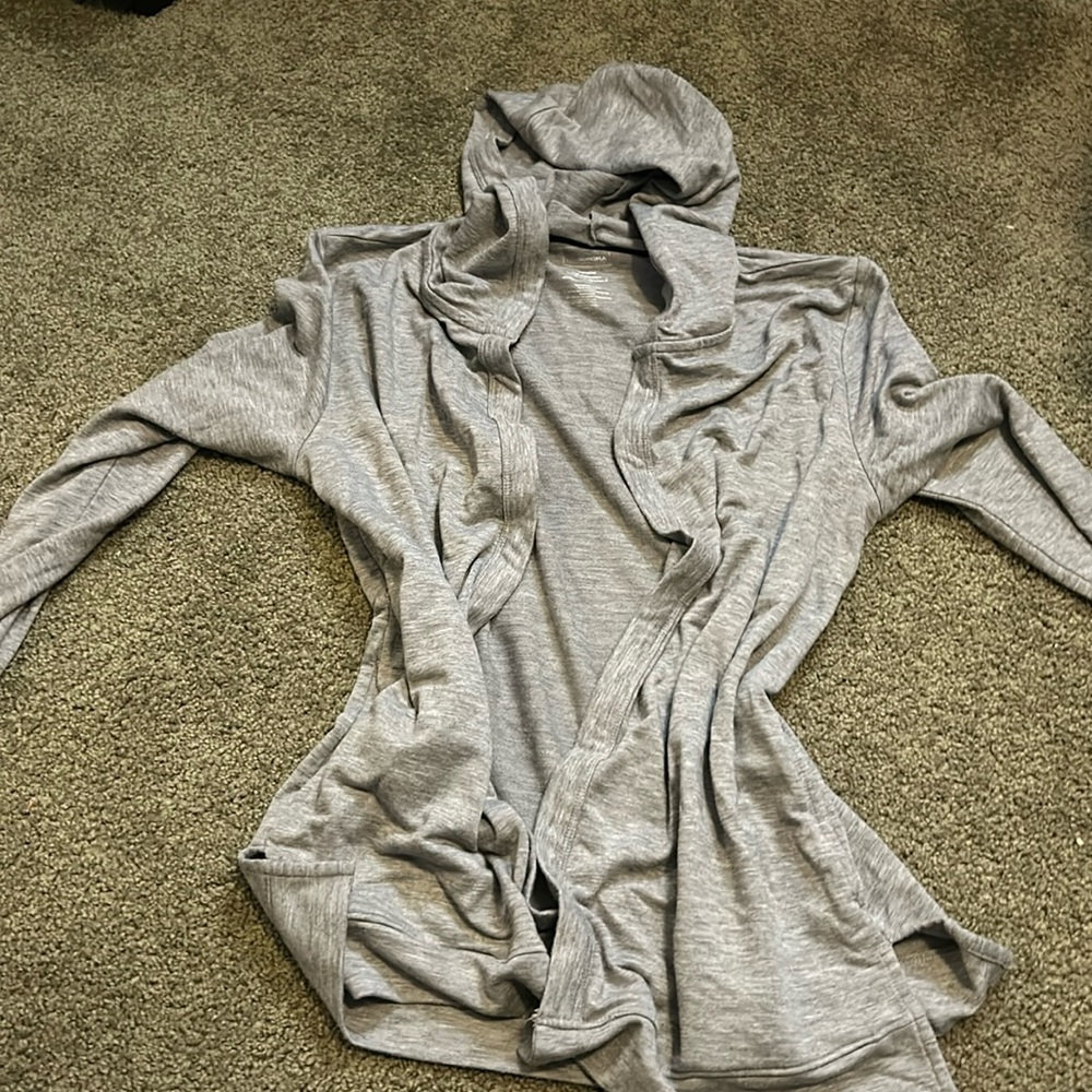 Grey open sweater size xs and has hood